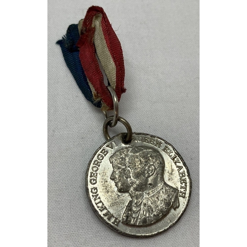 383 - A George VI coronation miniature medal, complete with ribbon.