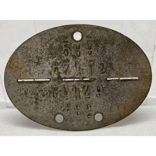 56 - A WWI style Late War Imperial German dog tag.  Approx. 7 cm long.