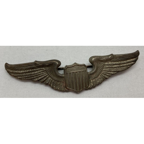 64 - A WWII style pilots wings, pin backed badge.  Approx. 7.5cm tall.