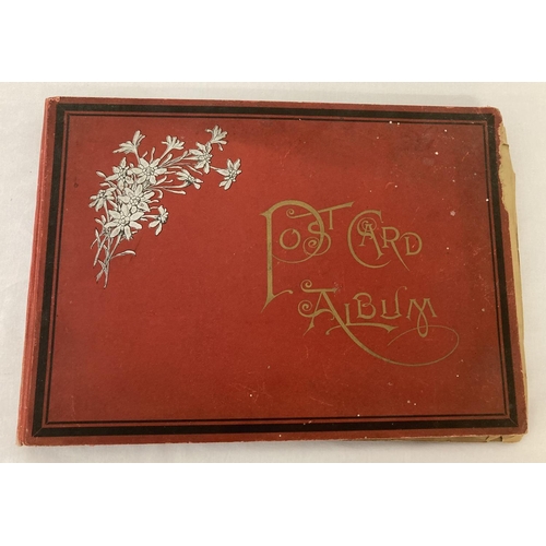 148 - A vintage red postcard album containing approx. 100 assorted vintage postcards.