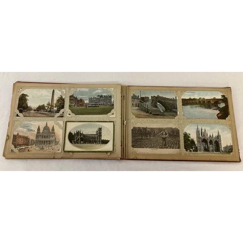 148 - A vintage red postcard album containing approx. 100 assorted vintage postcards.