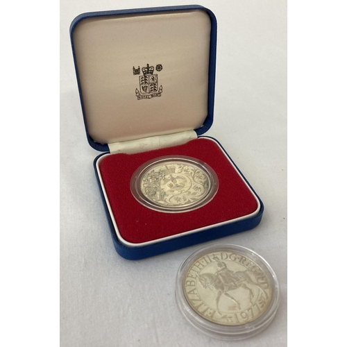 18 - 2 x 1977 Jubilee silver crown coins. One in clear base and boxed the other in clear case.