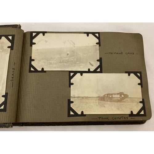 323 - A vintage photo album containing photographs of scouts and scout camps and trips.