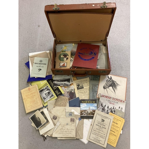 327 - A case containing a quantity of vintage mixed ephemera. To include Gymkhana programmes, postcards, h... 