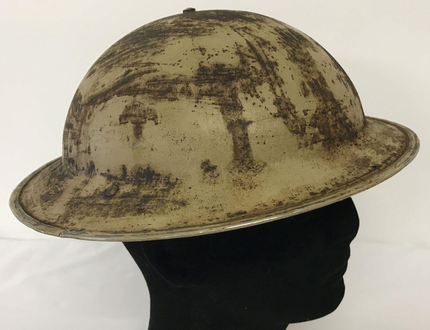 A WWII South African Brodie helmet and liner. Helmet complete with