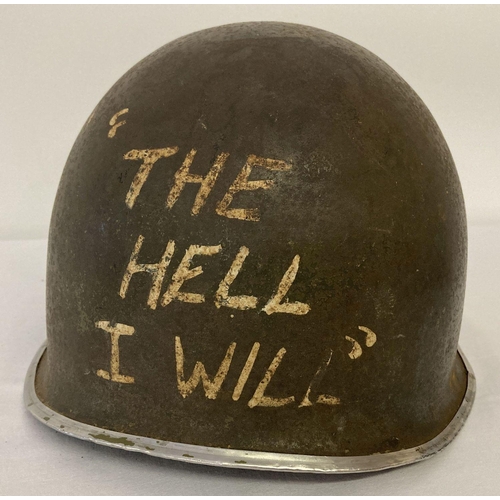 133 - A US M1 steel helmet with hand painted M.A.S.H detail, possible film prop, complete with liner.  She... 