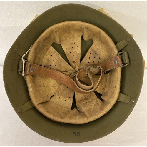 134 - An M39 Greek Army helmet with original factory wrapping paper, in as new condition.  Stamped 'Ellini... 