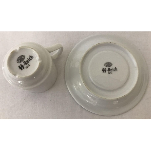 260 - A German WWII style Waffen SS white ceramic cup and saucer.  With printed markings to underside.