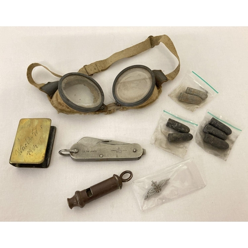 291 - A small collection of military related items. To include a 1940 whistle by Adie Bros, Birmingham  wi... 