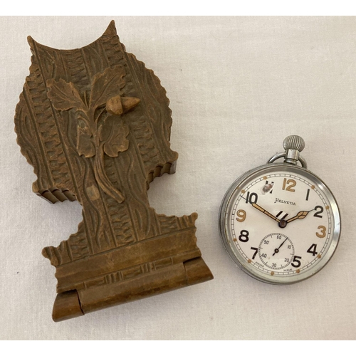 292 - A WWII Helvetia British Military pocket watch with carved wooden folding watch stand.  Top winding, ... 