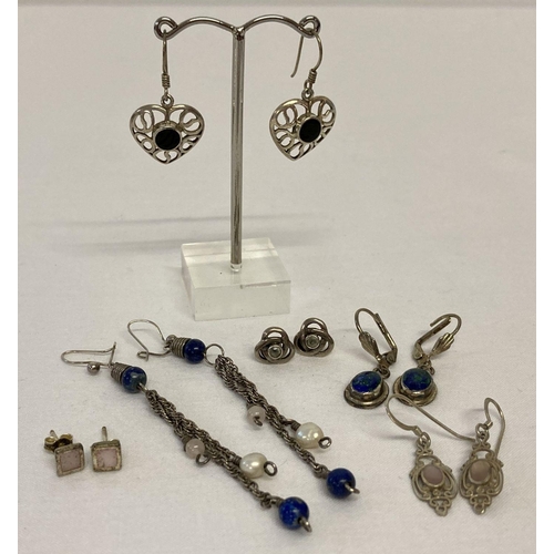 22 - 5 pairs of silver and white metal earrings in both drop and stud styles.  To include a pair of lapis... 