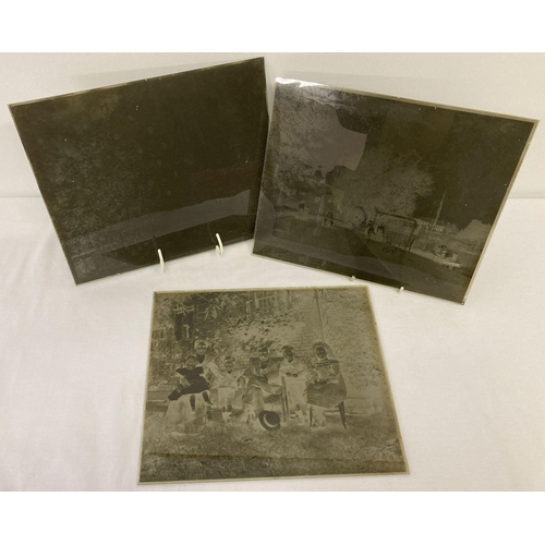 425 - 3 large sized Victorian/Edwardian glass plate negatives showing people in period dress.  A family po... 