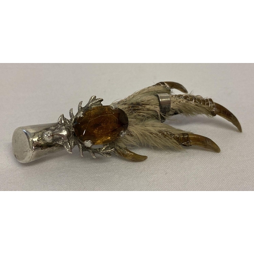 44 - A Scottish silver birds foot brooch with stag decoration and set with an oval citrine.  Hallmarked W... 