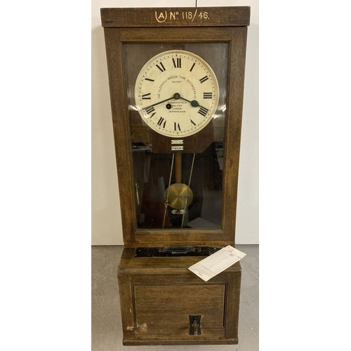 441 - A vintage oak cased Gledhill-Brook Time Recorders Ltd clocking in machine.  Metal face with Roman nu... 