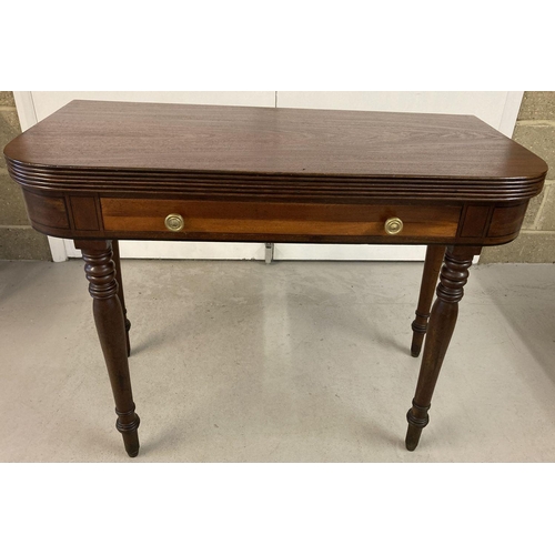 445 - A Georgian mahogany fold out breakfast table with turned legs and dummy drawer.   Approx. 76 x 101cm... 