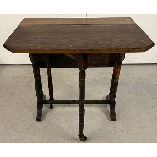 446 - An antique small Sutherland table with turned legs and supports with original ceramic casters.  Exte... 