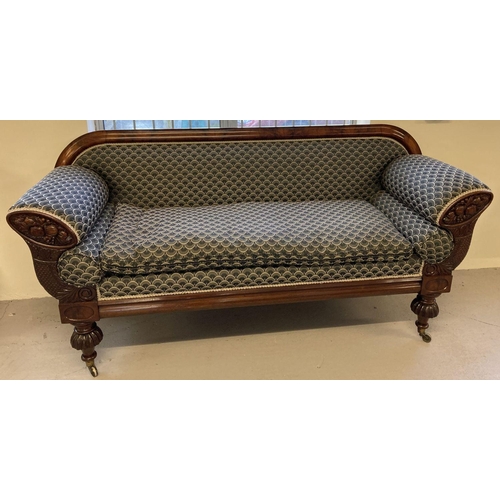 449 - A decorative Victorian mahogany settee with carved panels to arms and turned legs.  Recently upholst... 