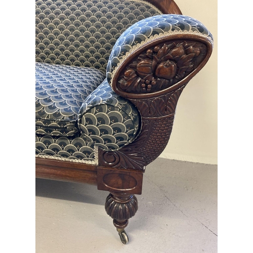 449 - A decorative Victorian mahogany settee with carved panels to arms and turned legs.  Recently upholst... 