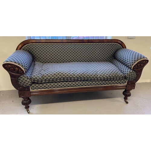 449 - A decorative Victorian mahogany settee with carved panels to arms and turned legs.  Recently upholst... 