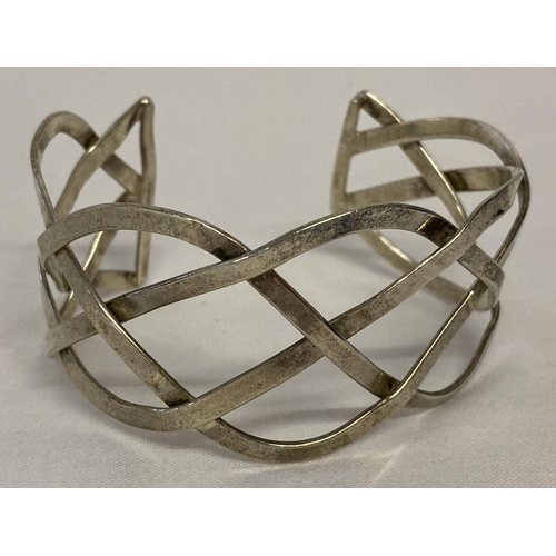 45 - A Mexican silver lattice work cuff bangle.   Total weight approx. 18.9g.