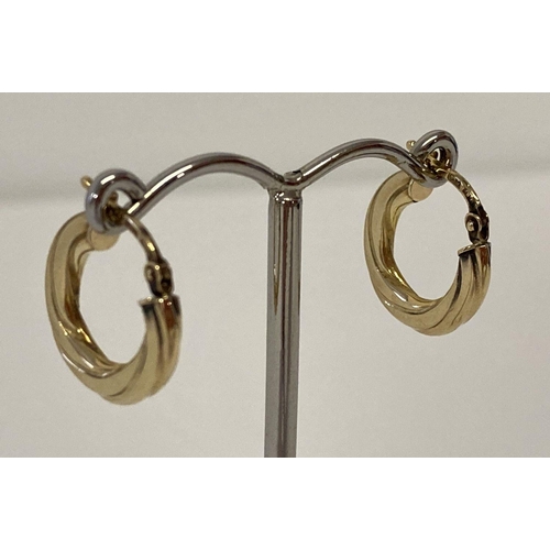 61 - A pair of 9ct gold twist style small hoop earrings.  Posts marked 9k with makers initials.  Total we... 