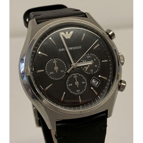 1005 - A men's chronograph wristwatch by Emporio Armani. Silver tone case with black engine turned face.  S... 