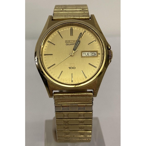 1020 - A vintage Seiko Quartz wrist watch. Gold face and case with luminous hands and day/date function.  R... 
