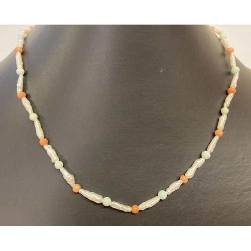 1040 - A baroque pearl, turquoise and coral bead necklace with 9ct gold clasp.  Total length approx. 22 inc... 