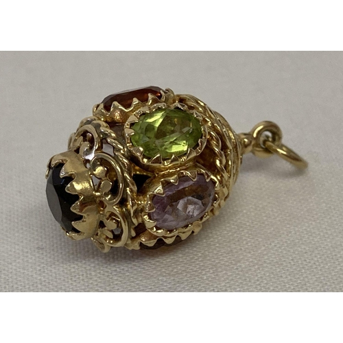 1078 - A 9ct gold multi gem set fob style pendant/charm.  Decorative egg shaped pendant with pierced scroll... 