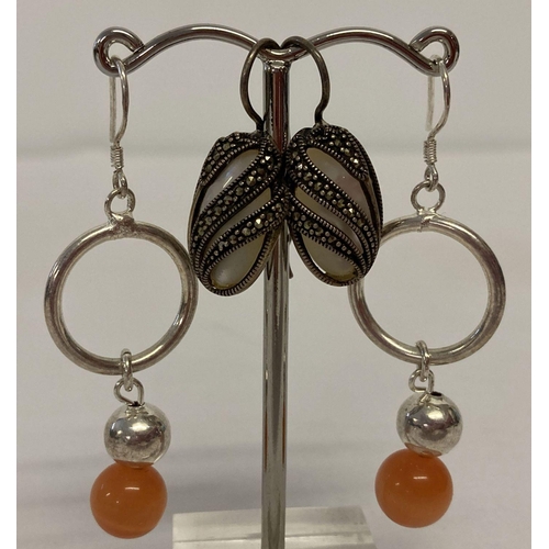 1086 - 2 pairs of silver drop style earrings. A pair set with mother of pearl with marcasite set overlays. ... 