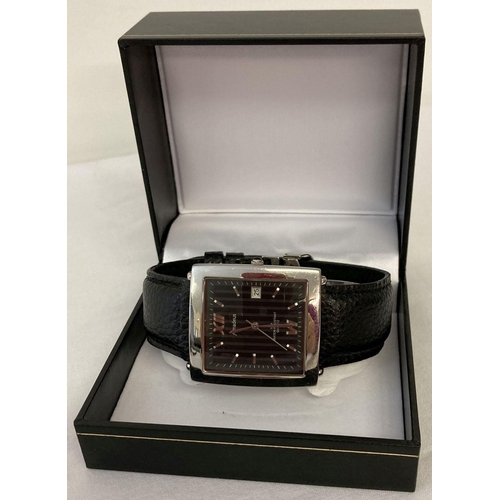 1128 - A boxed men's wristwatch by Amadeus with silver tone square case and black dial.  Silver tone hands ... 