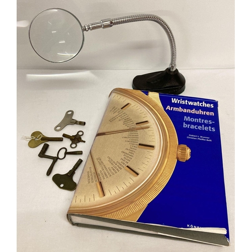 1136 - A watch makers magnifying glass together with a 