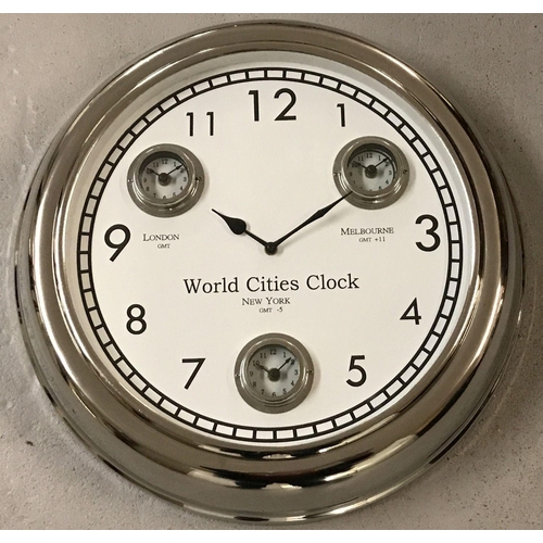 1143 - A large modern wall hanging, multi dial, world cities, clock with chrome finish.  Showing dials for ... 