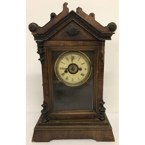 1144 - A vintage wooden cased mantel clock with pendulum and partial retailer original label to back.  Deco... 