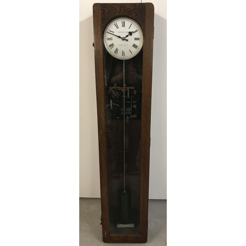 1156 - A mid 20th century oak cased 'Synchronome' electric master clock from Speed & Sons, Kings Lynn.  Sil... 