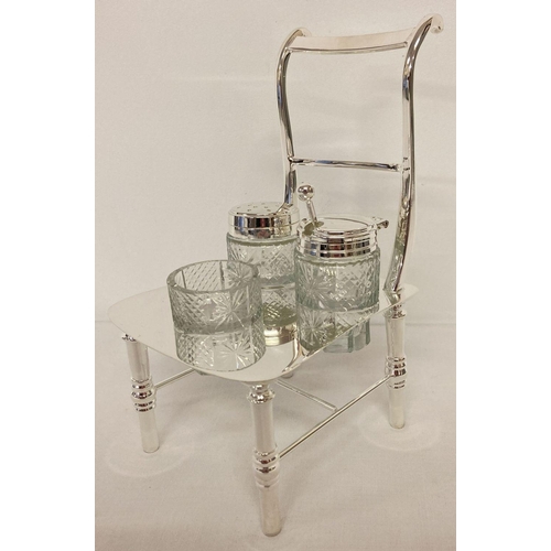 1170 - A silver plated and cut glass novelty cruet in the shape of a chair.   Approx. 20.5cm tall.