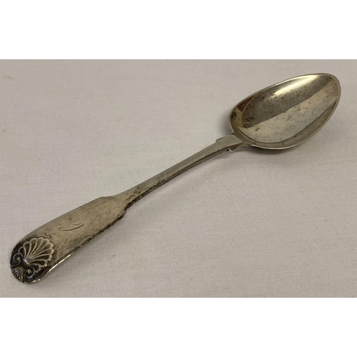 1173 - A Georgian Scottish silver dessert spoon with scallop shell design to handle.  Hallmarked Edinburgh ... 