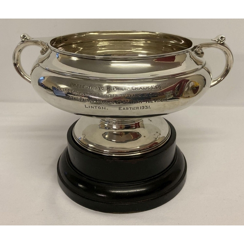 1179 - A solid silver rose bowl with plinth and dedication to front marked Munsey & Co Ltd, Cambridge.  Ded... 