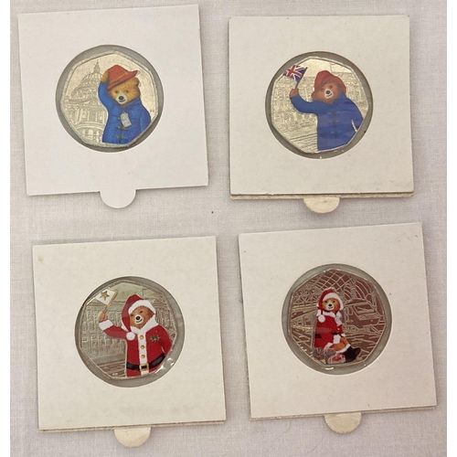 1183 - A collection of 4 Paddington Bear 50p coins with sticker decals.  Paddington At The Station and Padd... 