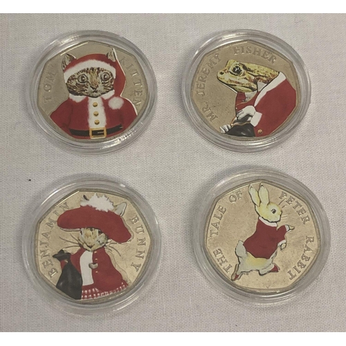 1184 - A collection of 4 Beatrix Potter 50p coins all with Christmas sticker decals. Tom Kitten, Benjamin B... 