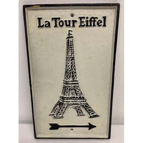 1198 - A black and white painted cast iron wall sign with directional arrow for the Eiffel Towel.   Approx.... 