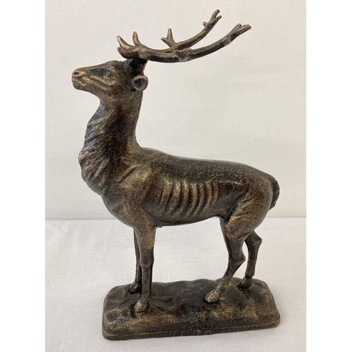 1203 - A bronzed effect cast metal figure of a stag.   Approx. 29cm T x 19cm L.