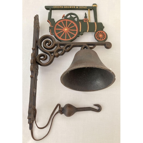 1205 - A painted cast metal wall hanging garden bell with Joseph Brewer & sons Traction engine detail.   Ap... 