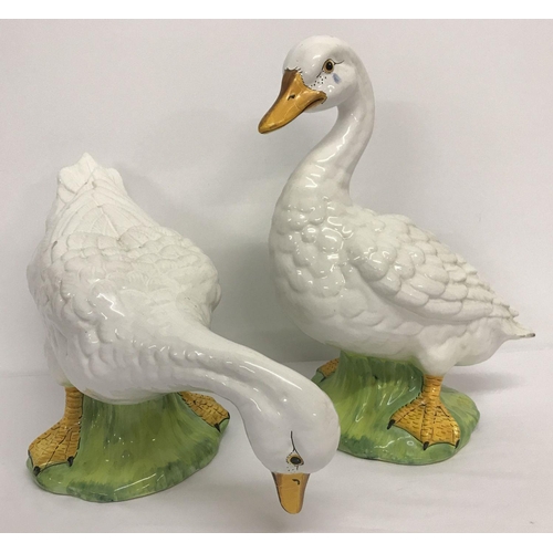 1234 - 2 large Italian ceramic geese figures with hand painted detail.   Largest approx. 37cm tall.