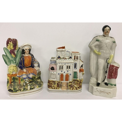 1246 - 3 ceramic Staffordshire flatback figurines.  A house, a gentleman and a gentleman sitting in a garde... 