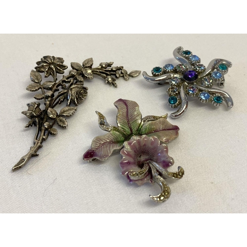 16 - 3 floral design vintage costume jewellery brooches.  A silver tone floral spray, a flower design set... 