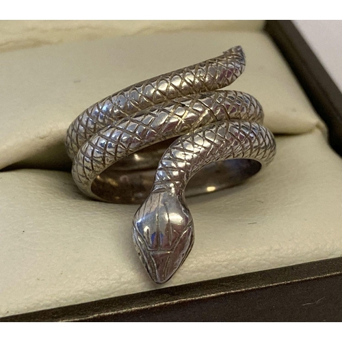 58 - A silver serpent ring with scale decoration throughout.  Size K½.  Approx. 5.7g.