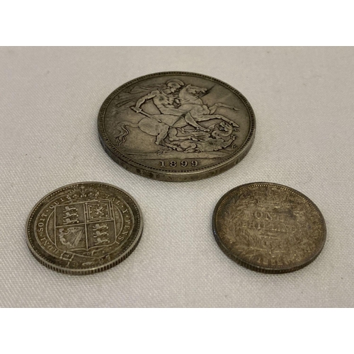 117 - 3 Victorian silver coins. An 1899 veiled head crown.  Together with a young head 1852 shilling and a... 