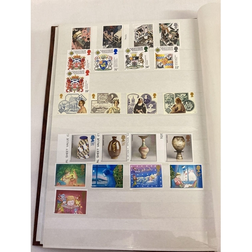 204 - A large brown album containing 400 British unused stamps and 8 first day covers.  Stamps include set... 