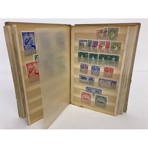 209 - A small vintage album containing antique and vintage postage stamps, mostly unused.  To include Vict... 